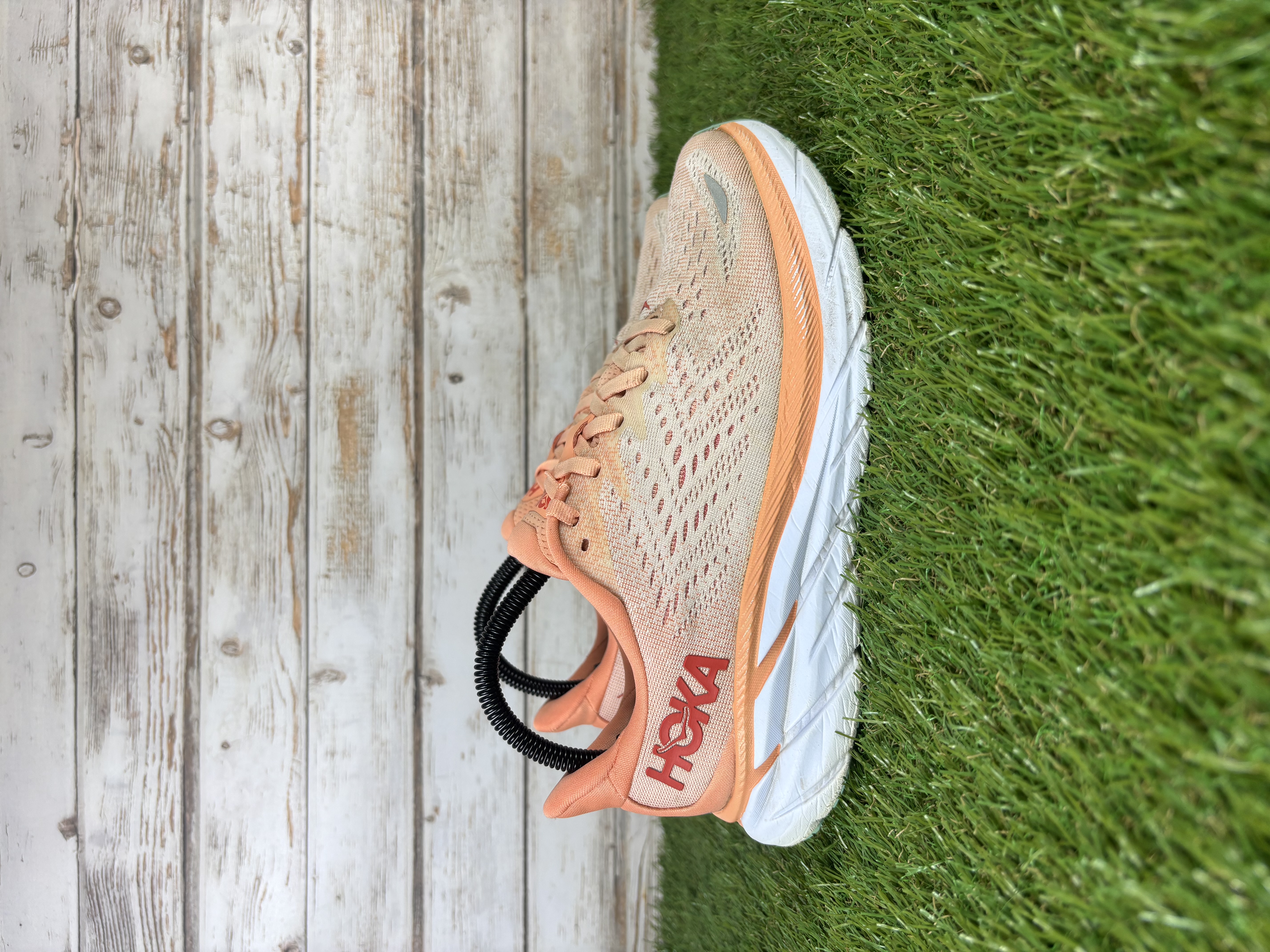 Orange Hoka running trainers